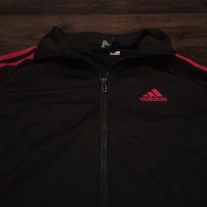 COPY - An adidas jacked with red stripes